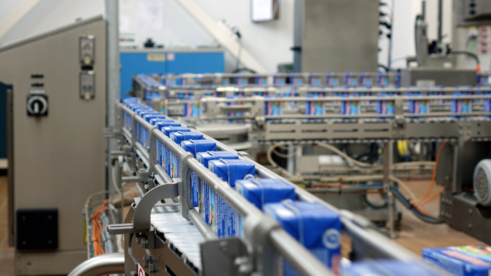 Food and beverage processing facility with conveyor belt and industrial machinery